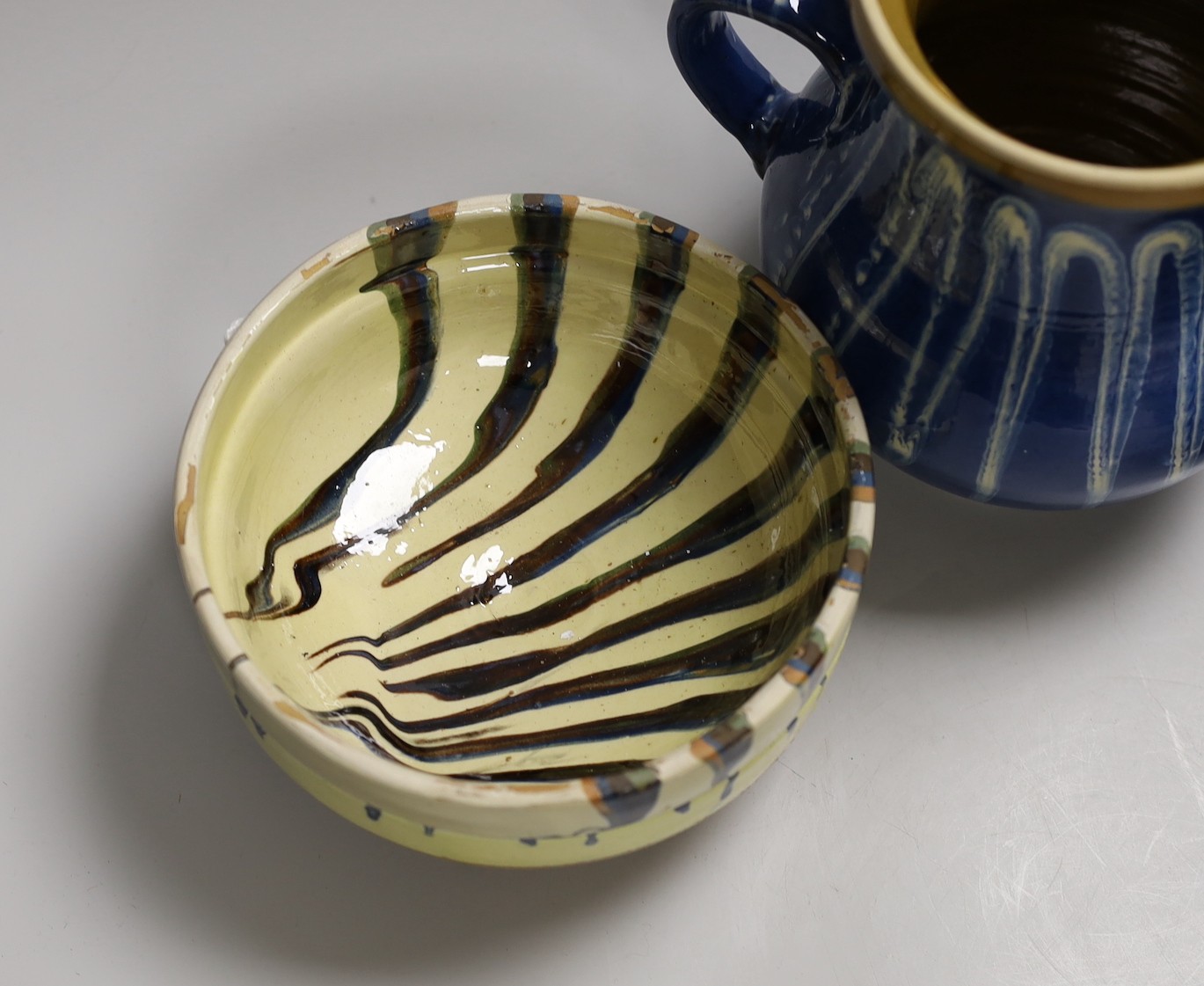 A group of six polychrome slipware bowls and a jug- 18cms high